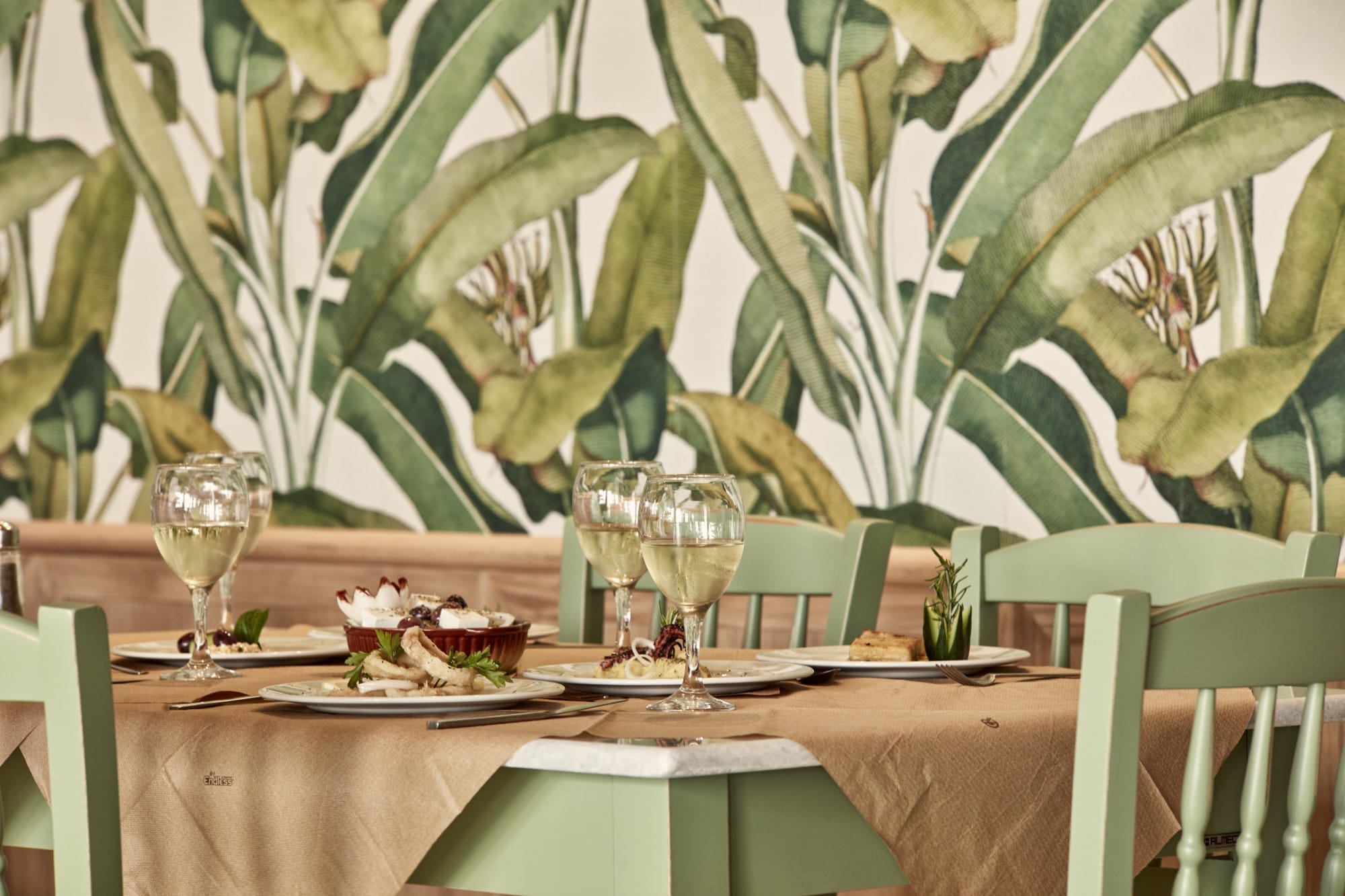 a table with glasses and plates on it