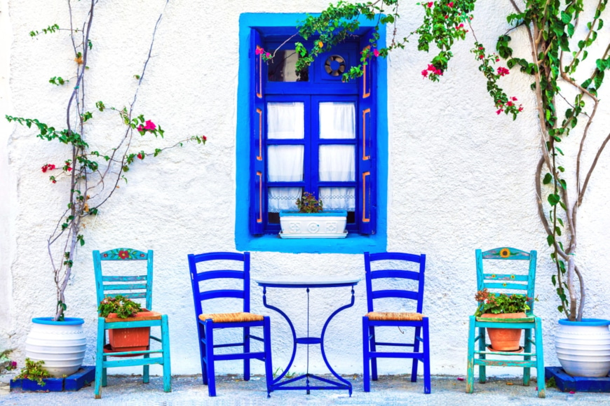 a row of chairs outside a house