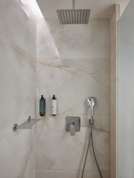 a shower with a bottle of soap