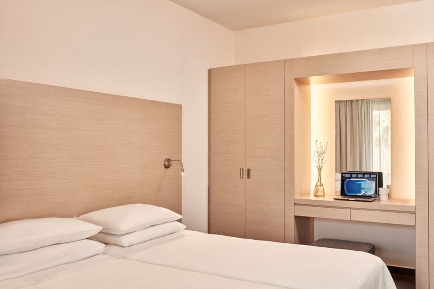 a bed with a television on it