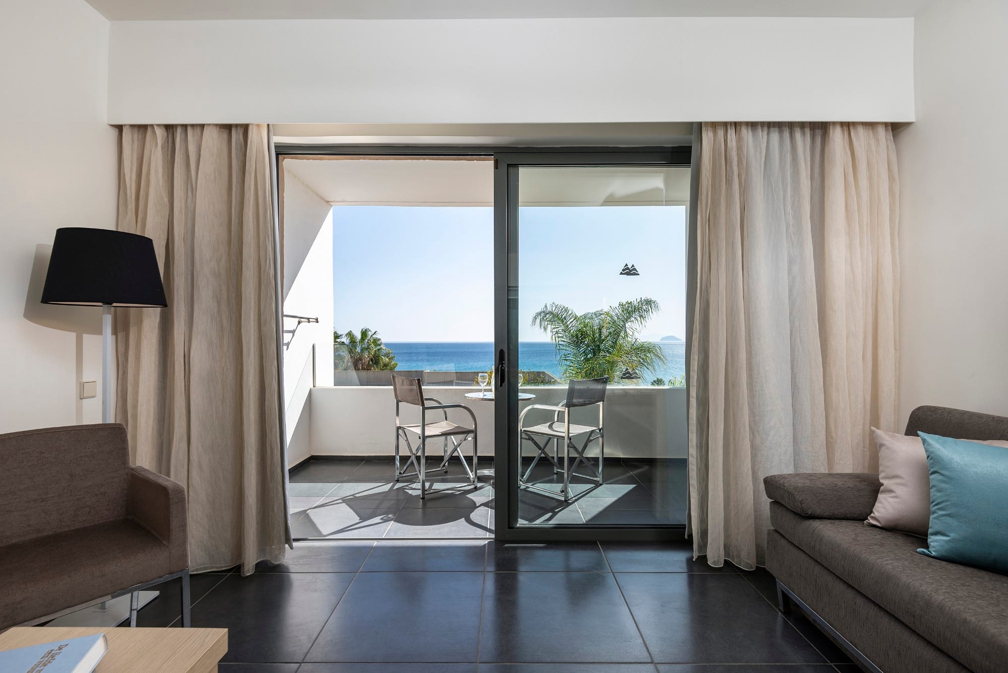 a living room with a large glass door