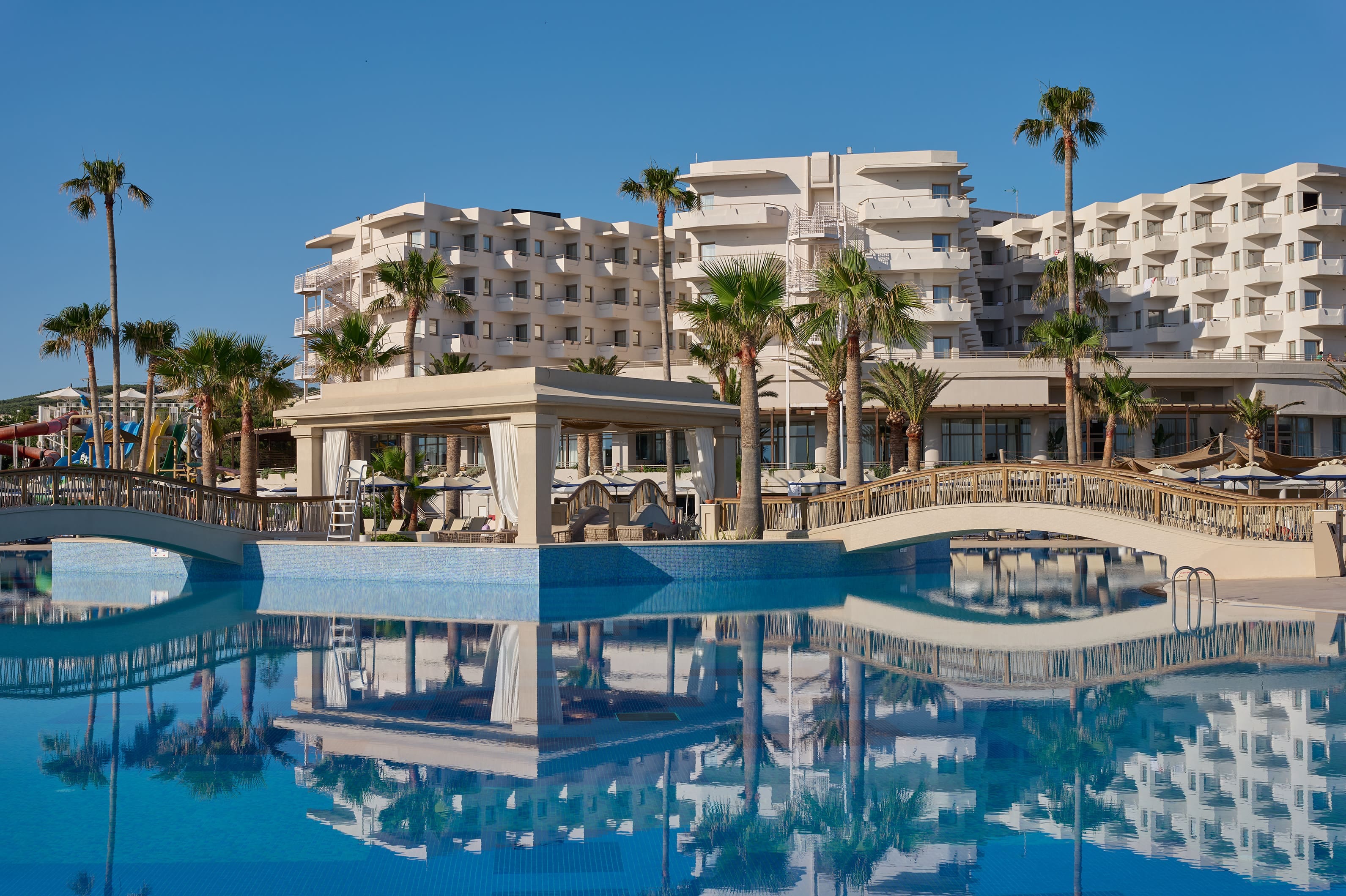 a pool with a building in the background