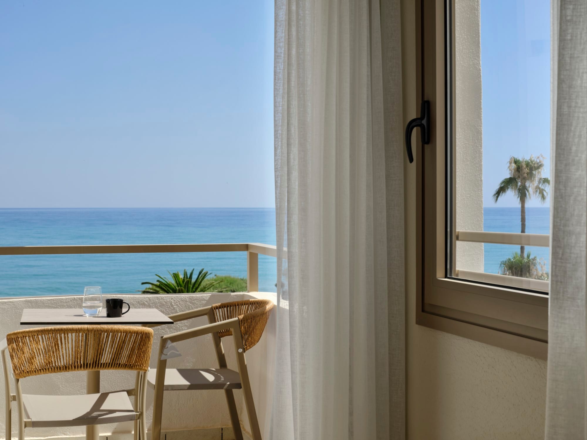 a table and chairs by a window