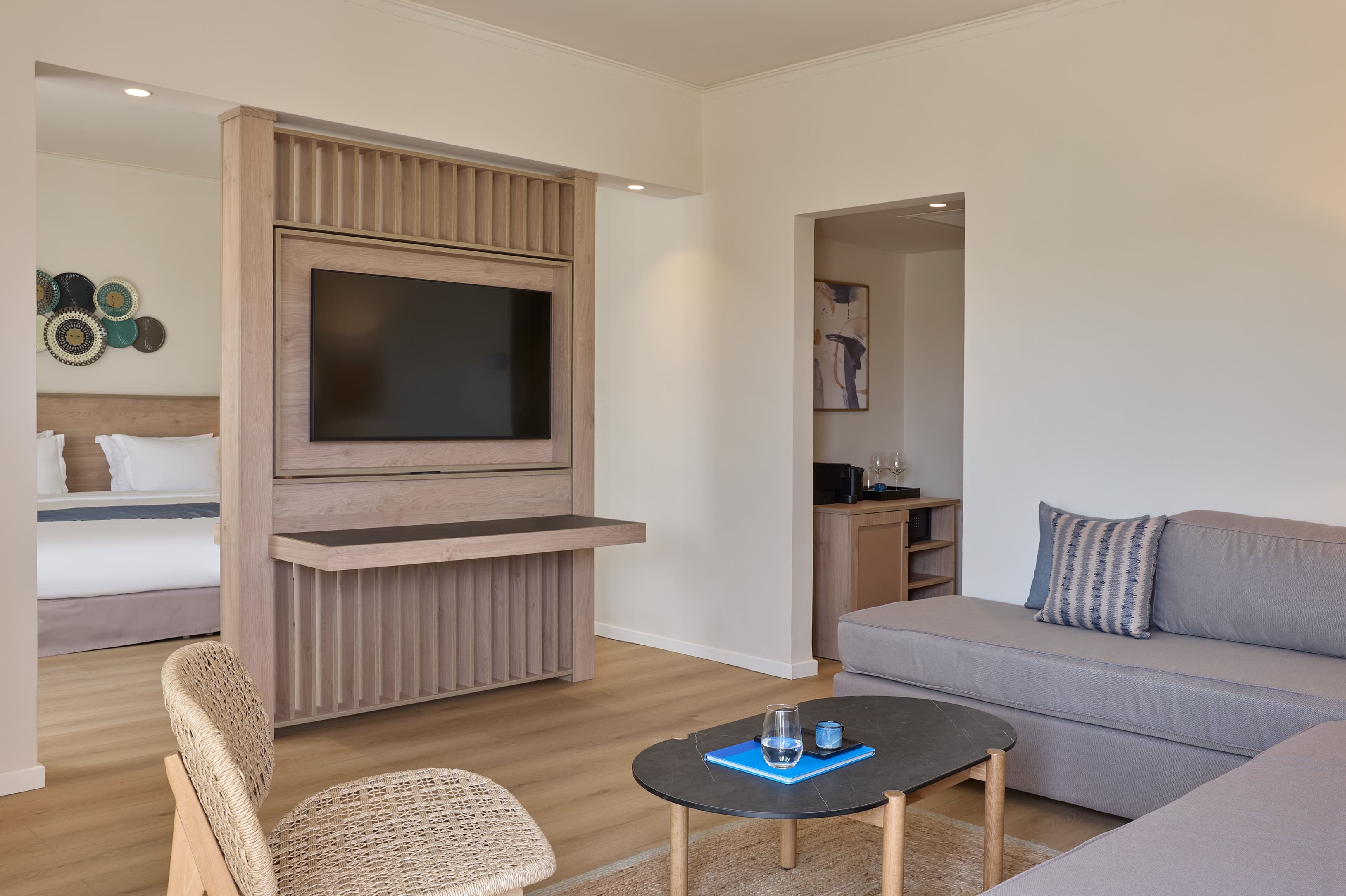 a living room with a tv and couches