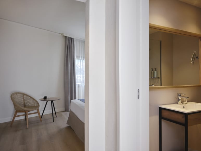 a bathroom with a tub sink and toilet