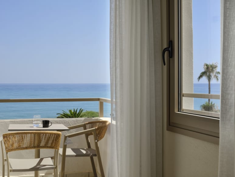 a table and chairs by a window