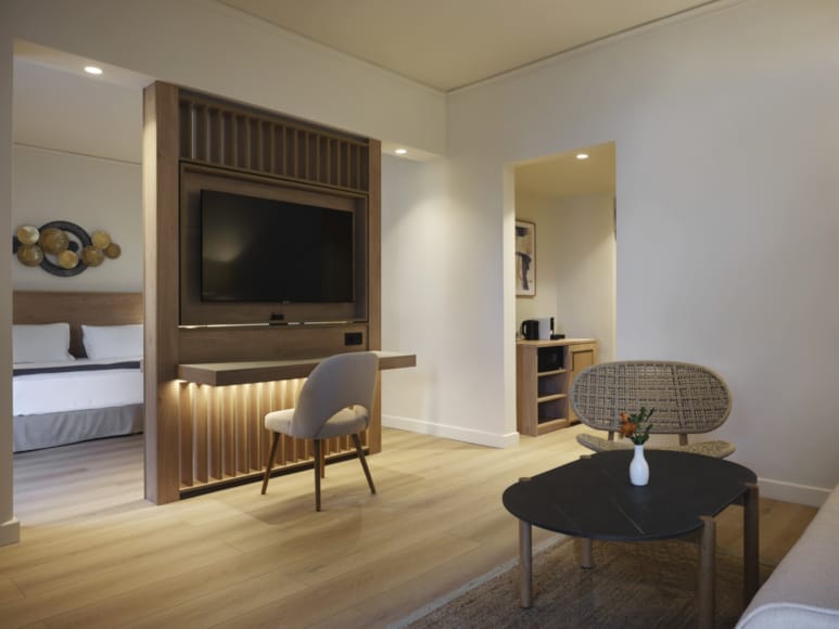 a living room with a tv and a table