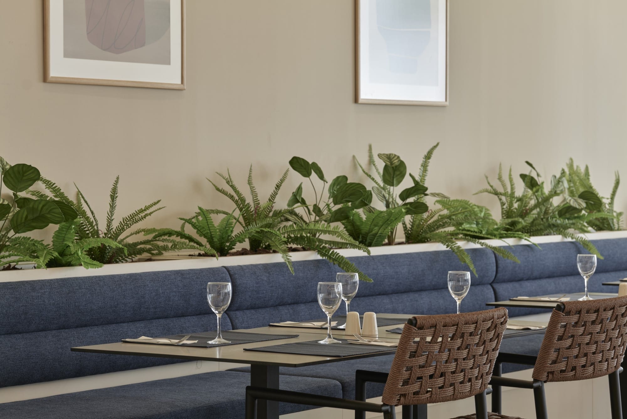 a table with glasses and plants on it