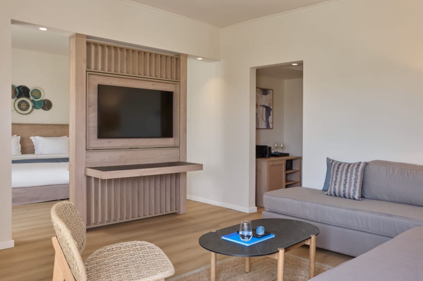 a living room with a tv and couches