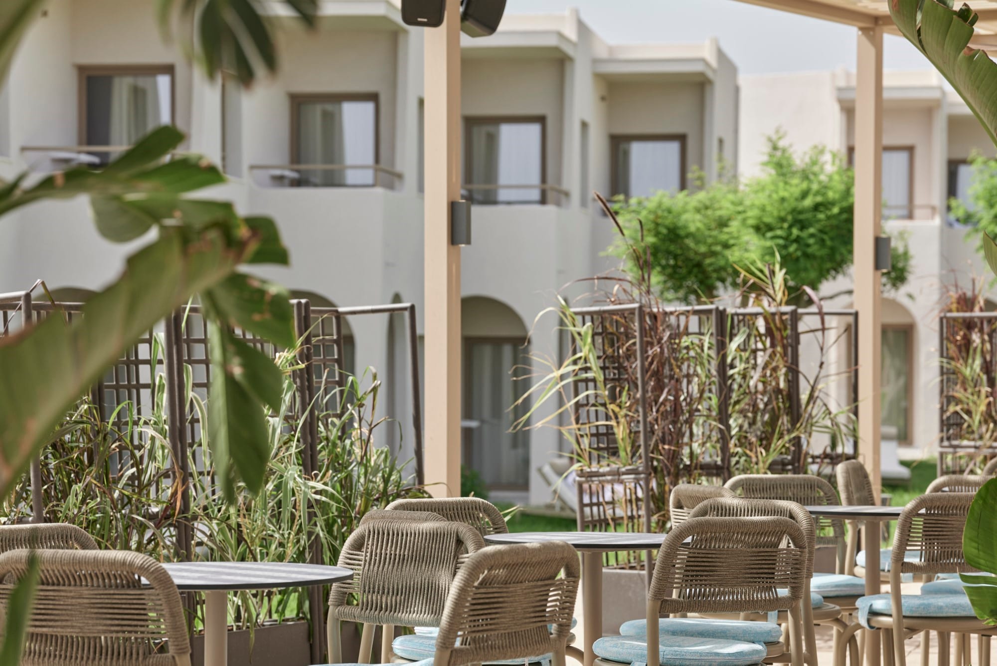 a patio with tables and chairs