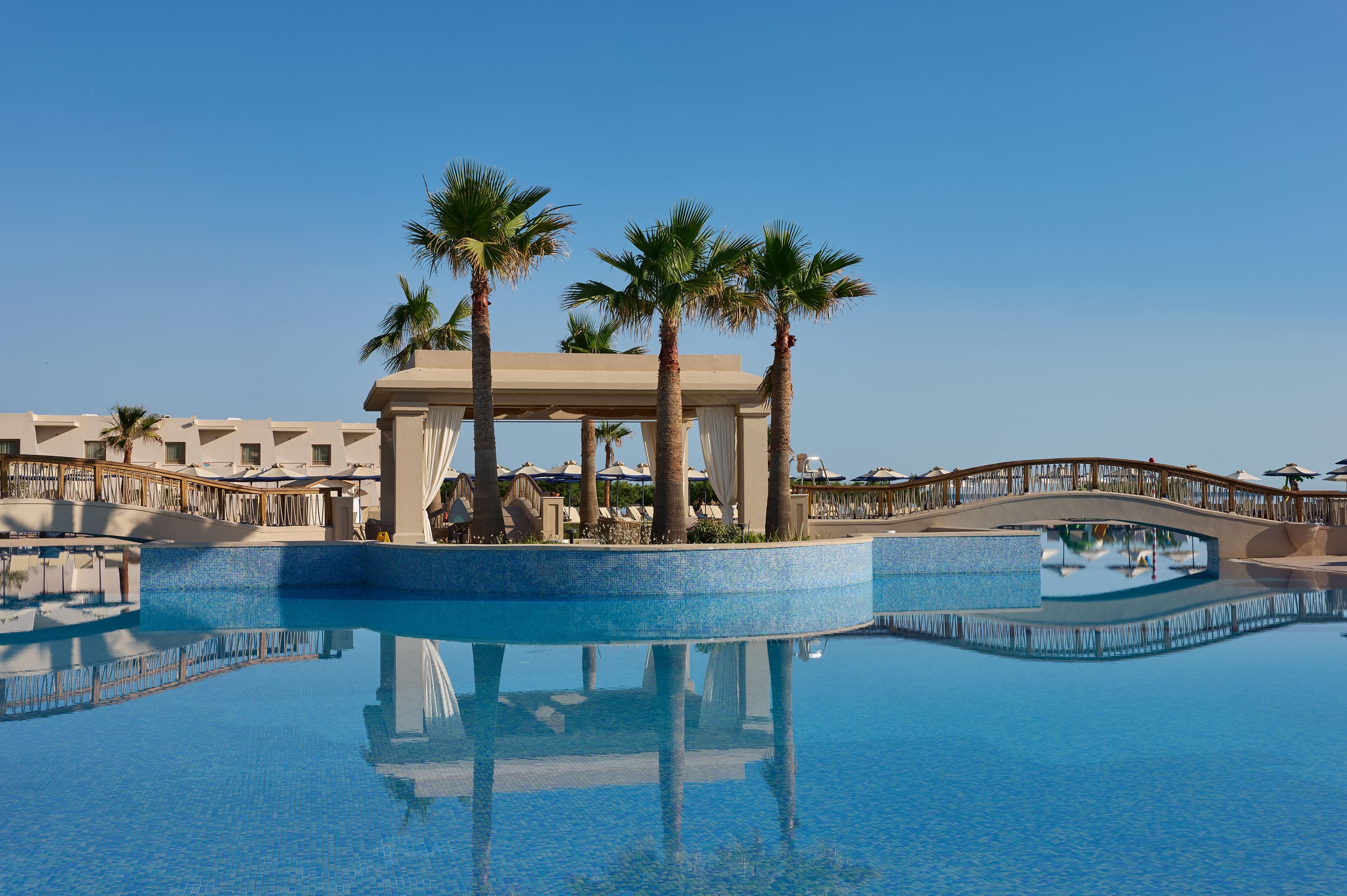 a pool with a building in the background