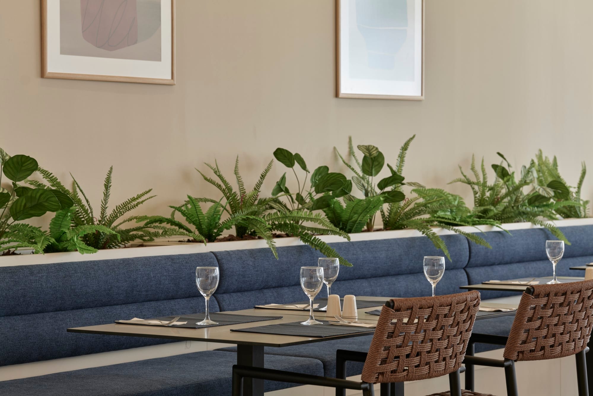 a table with glasses and plants on it