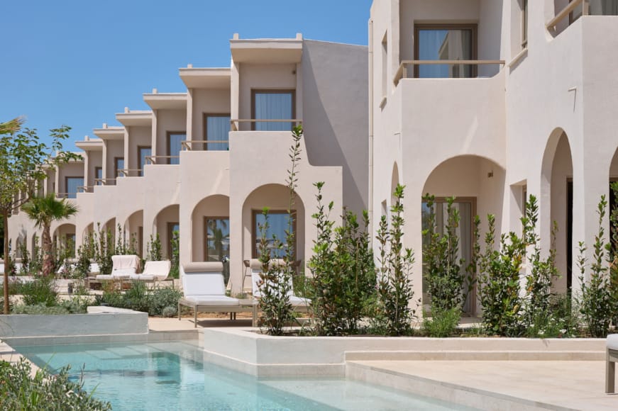 a white building with a pool