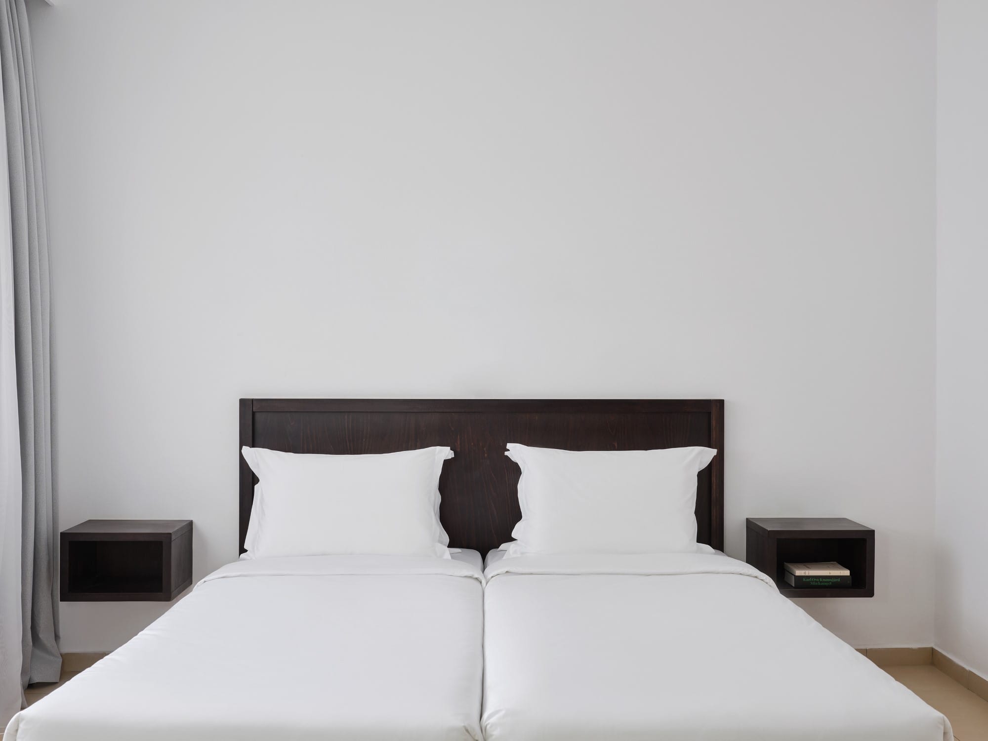 a bed with a white bed spread