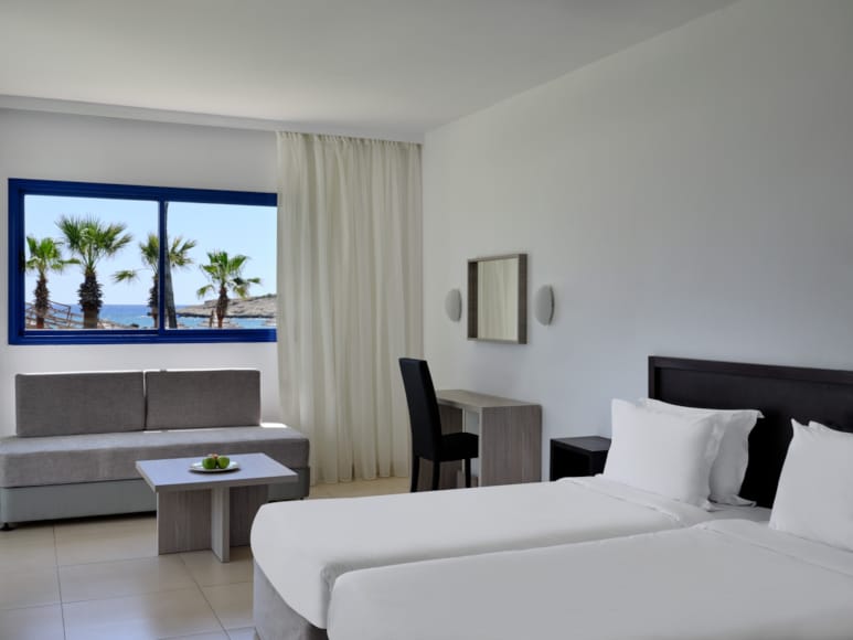 a bedroom with a large window