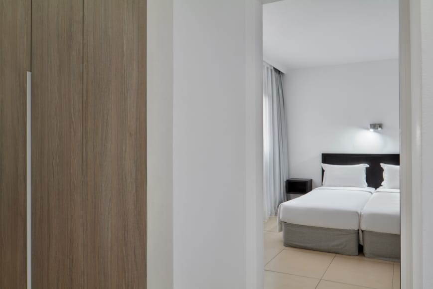 a room with a bed and a desk