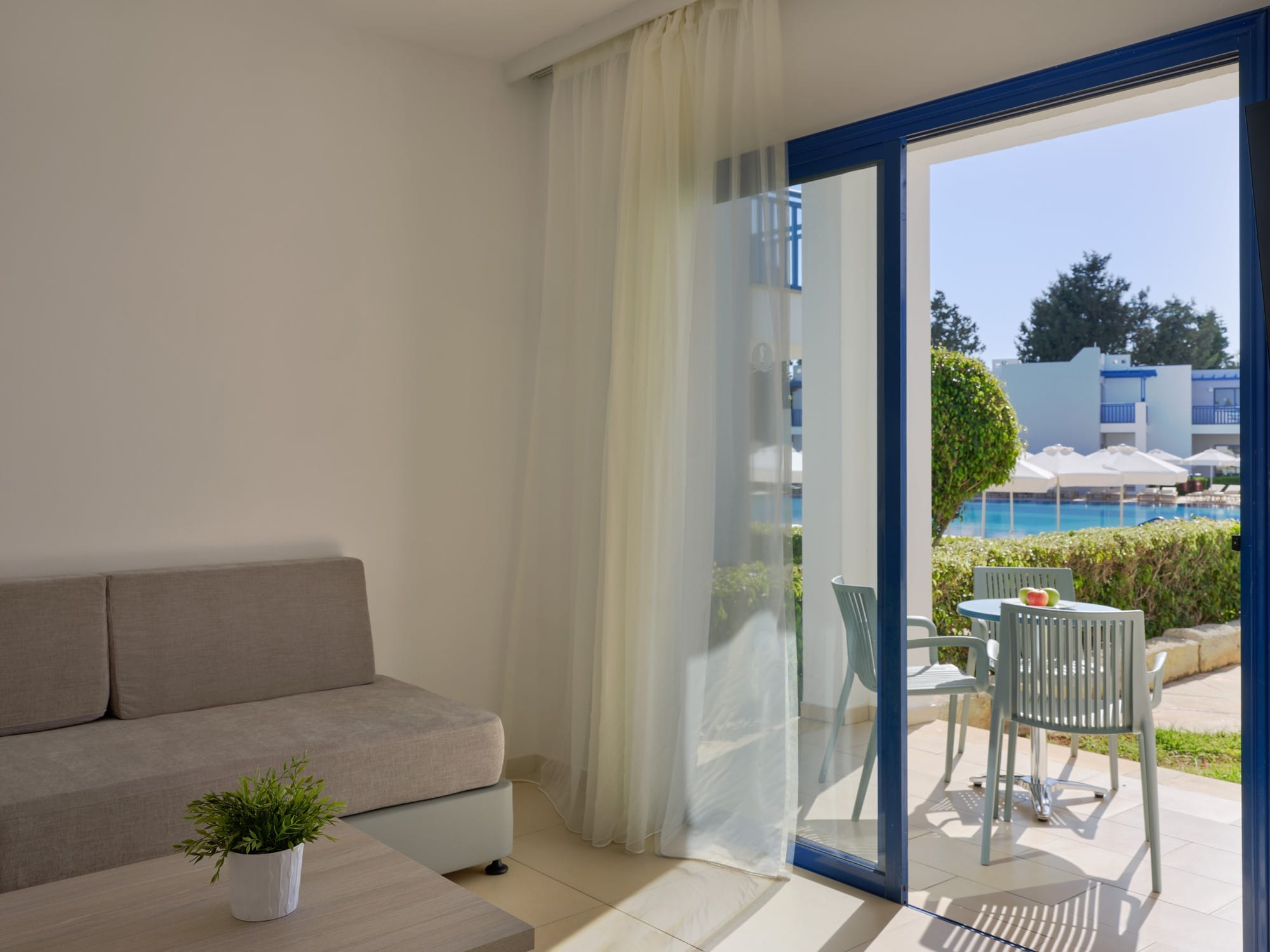 a living room with a glass door