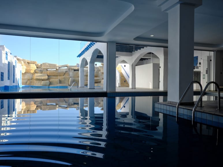 a swimming pool with a large window