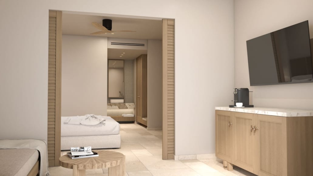 a room with a bed and a tv