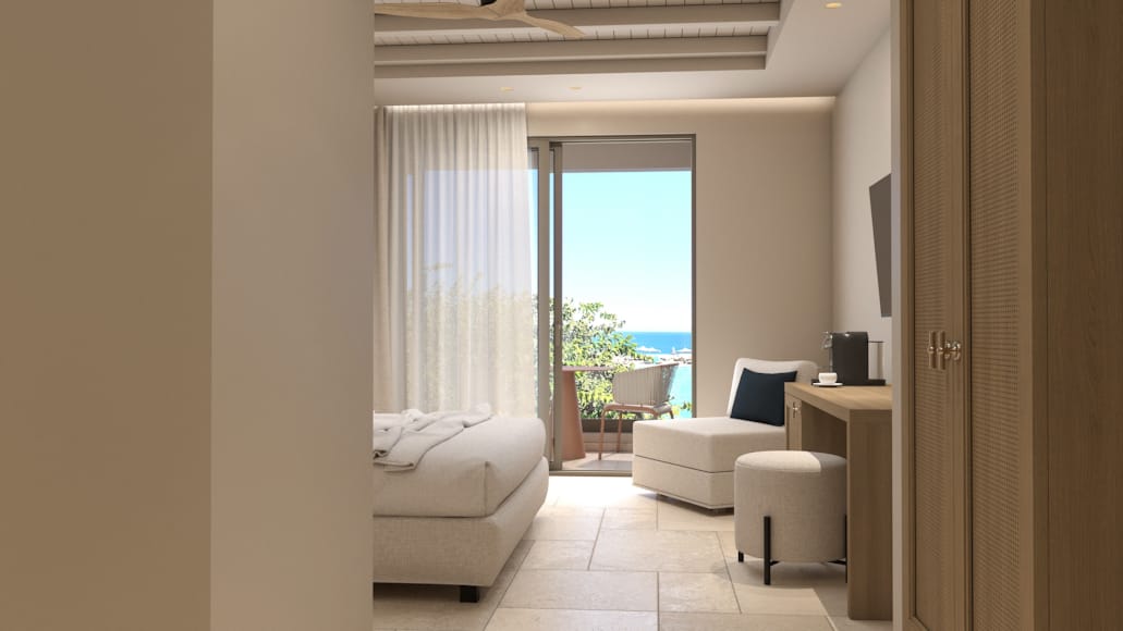 a room with white couches and a window