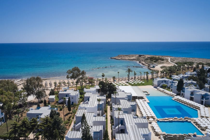 a resort with a pool and a beach