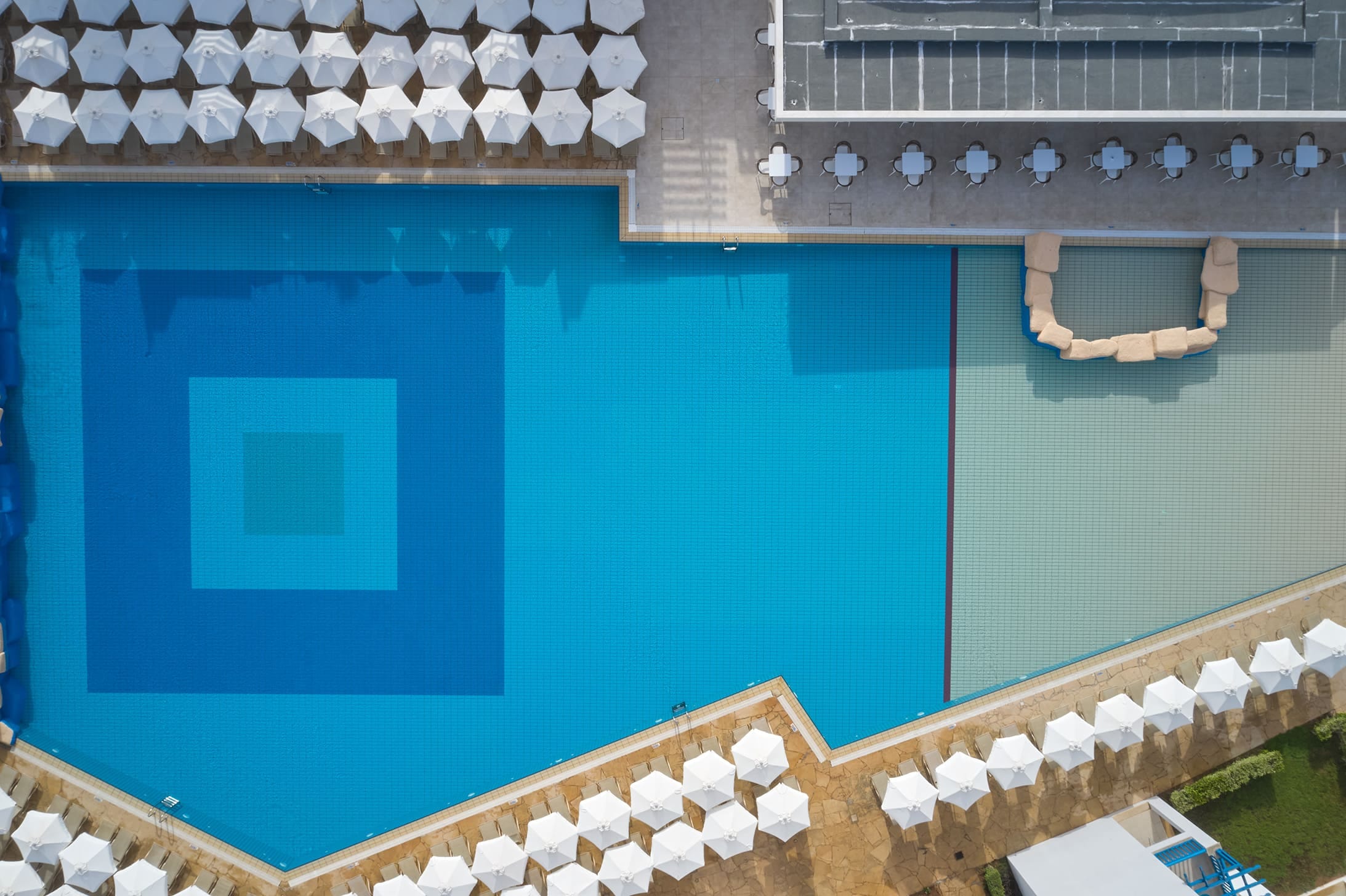 a blue wall with a white square and a white square with a white square and a white square