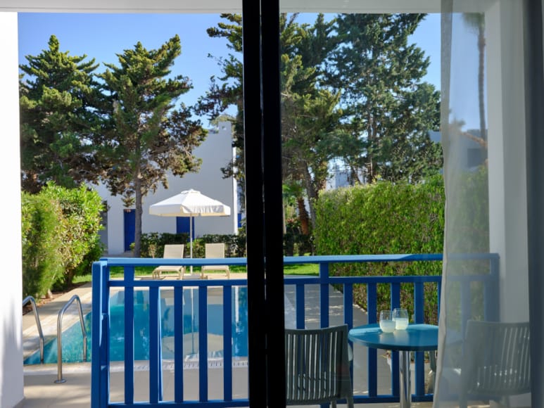 a patio with tables and chairs