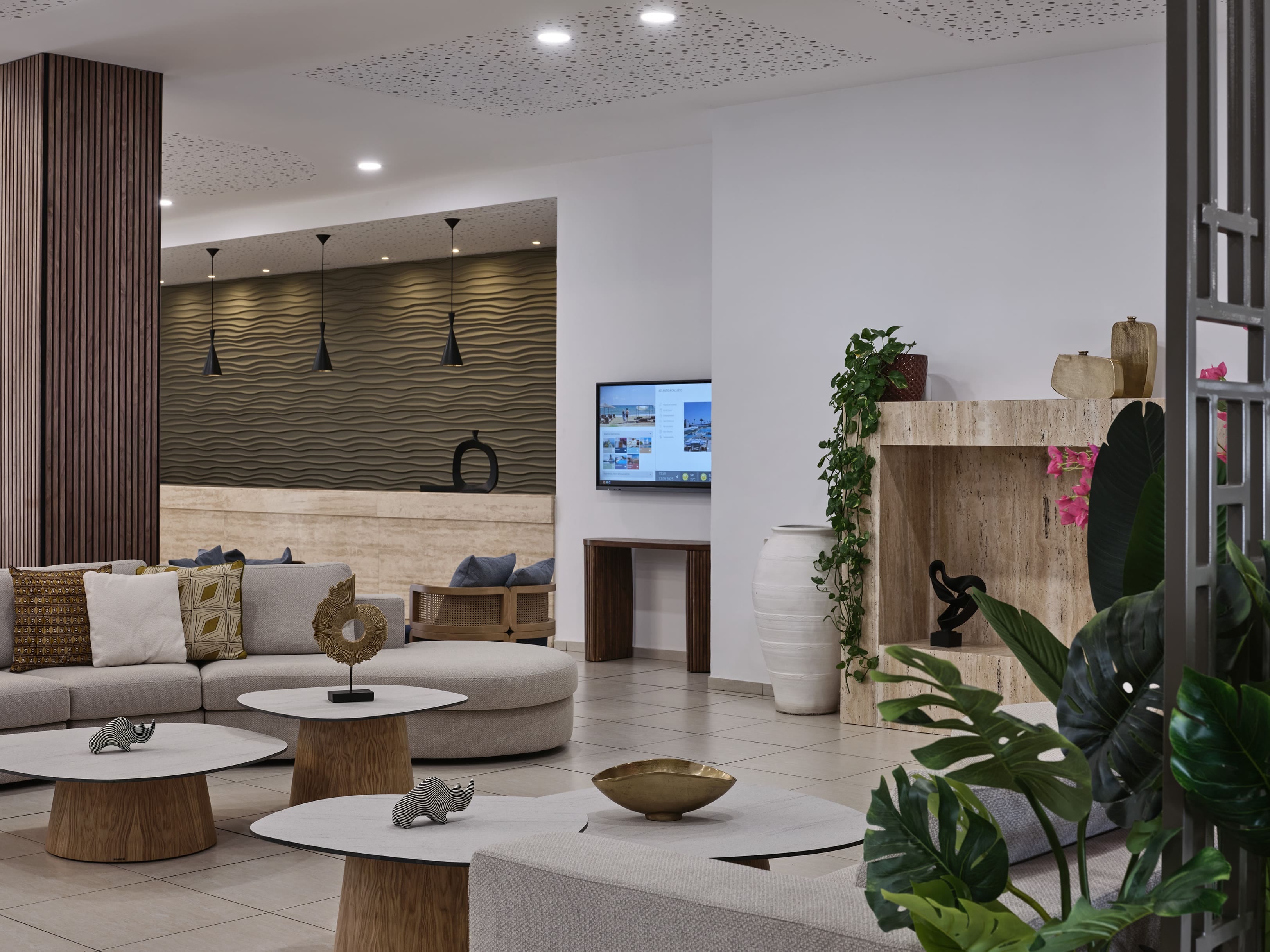 a living room with a tv and furniture