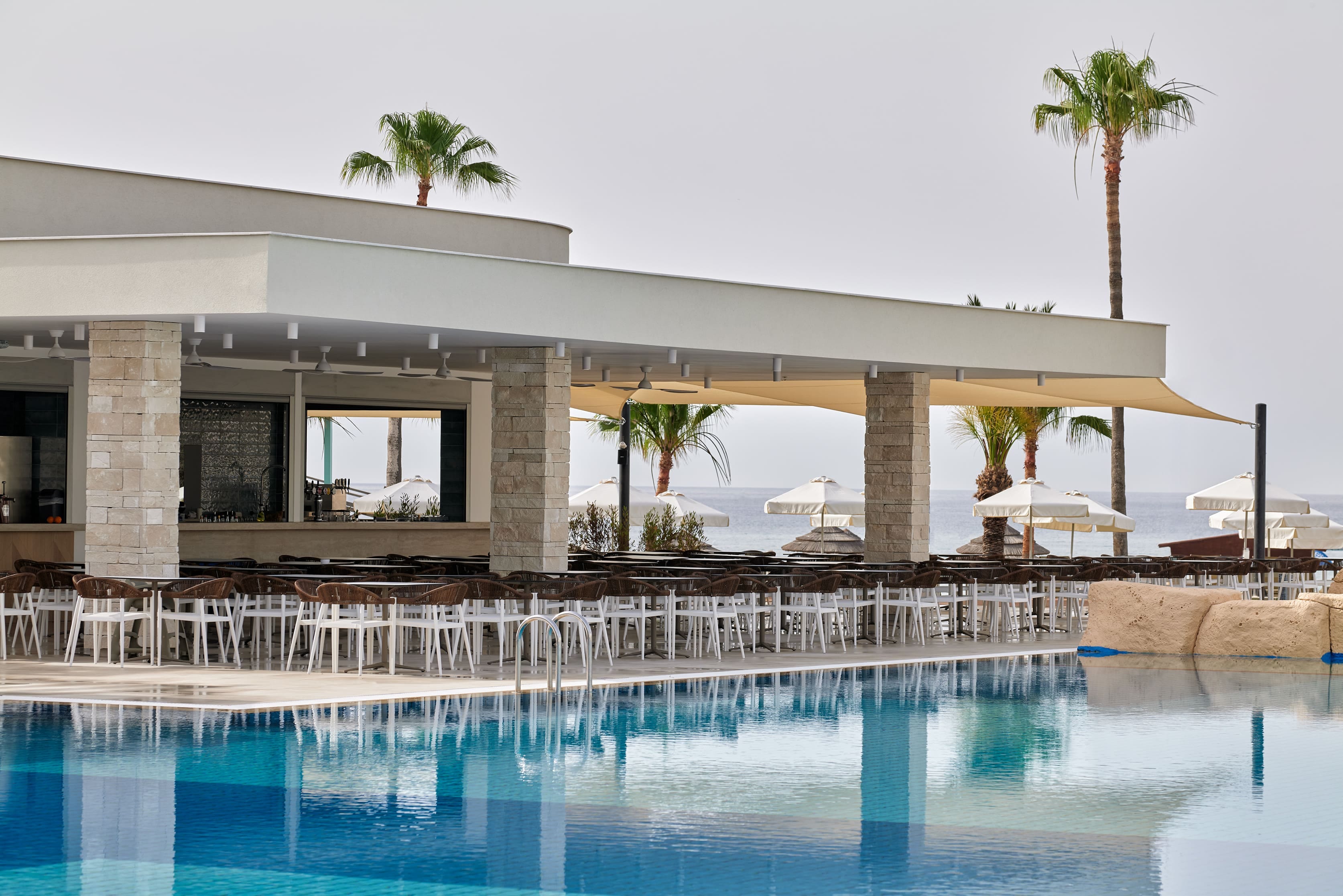 a pool with chairs around it