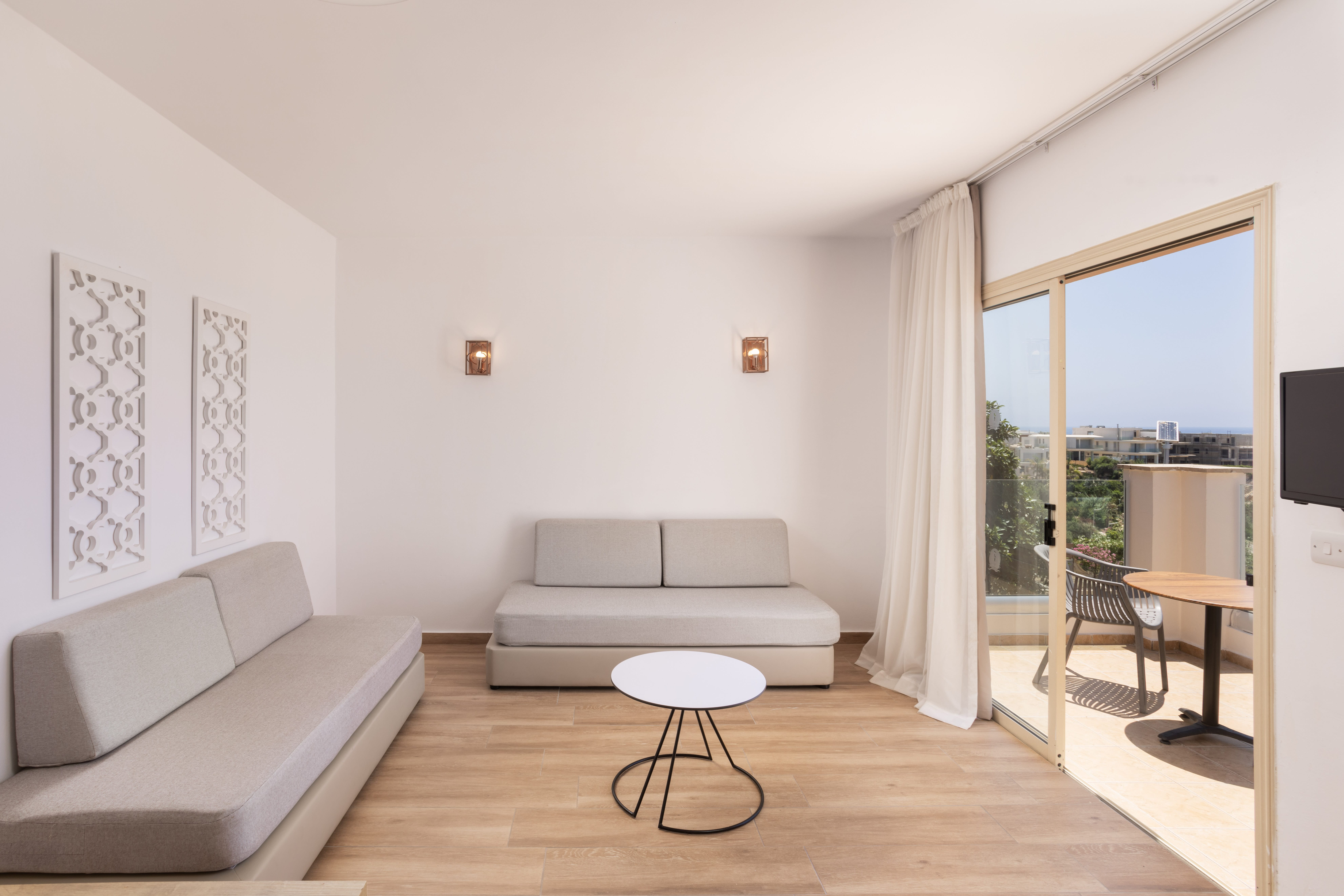 a living room with a white couch and a table