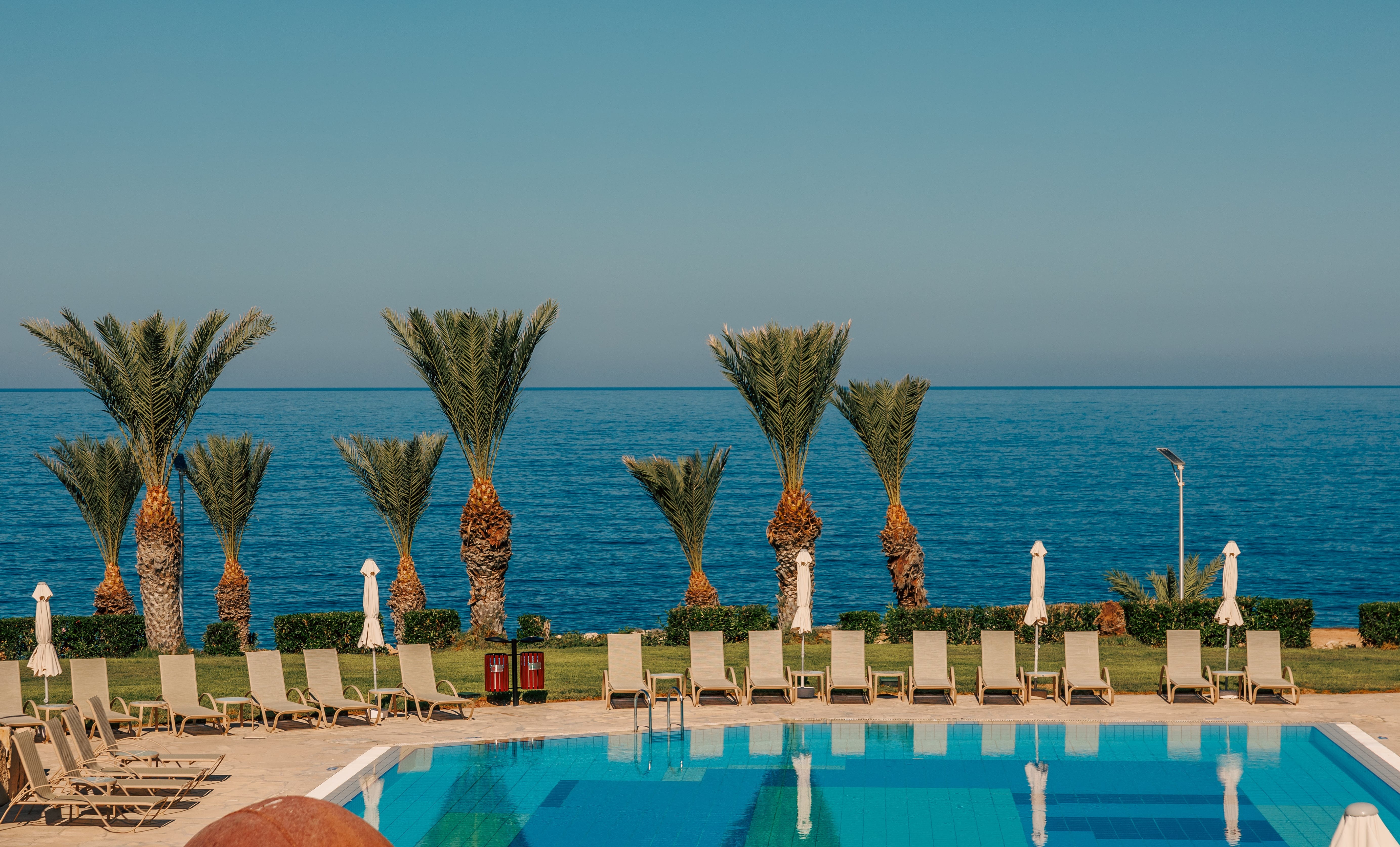 a pool with chairs around it