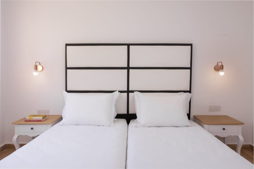a bed with white sheets