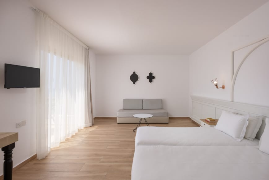 a room with white furniture