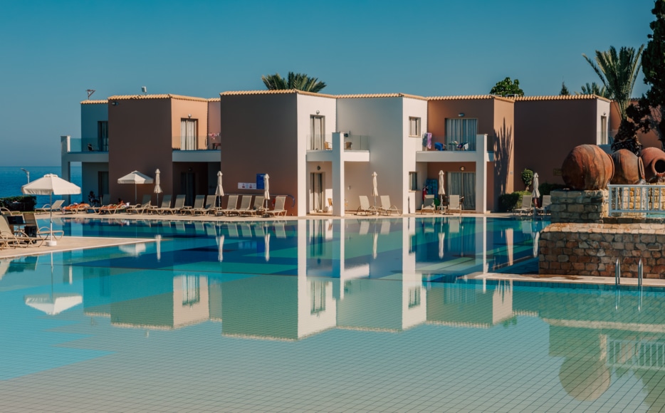 a pool with a building in the background