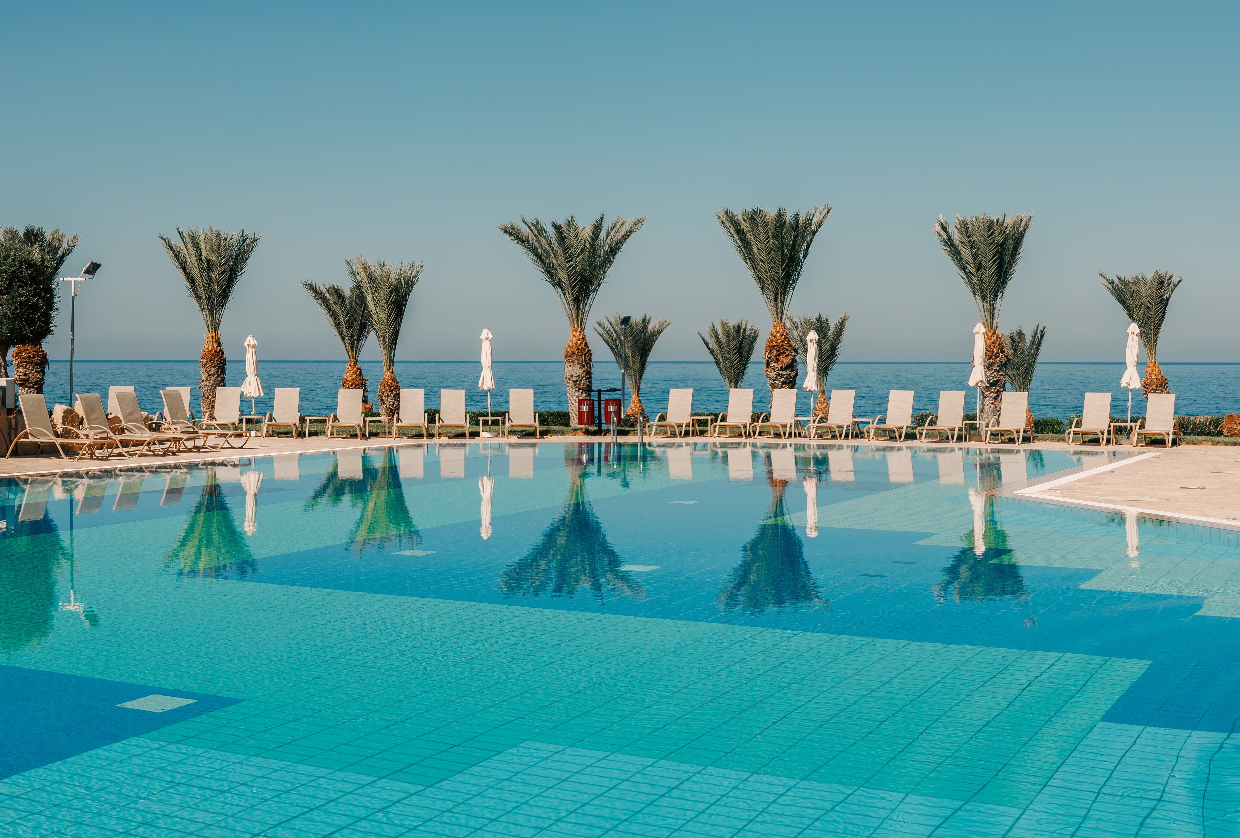 a pool with chairs around it