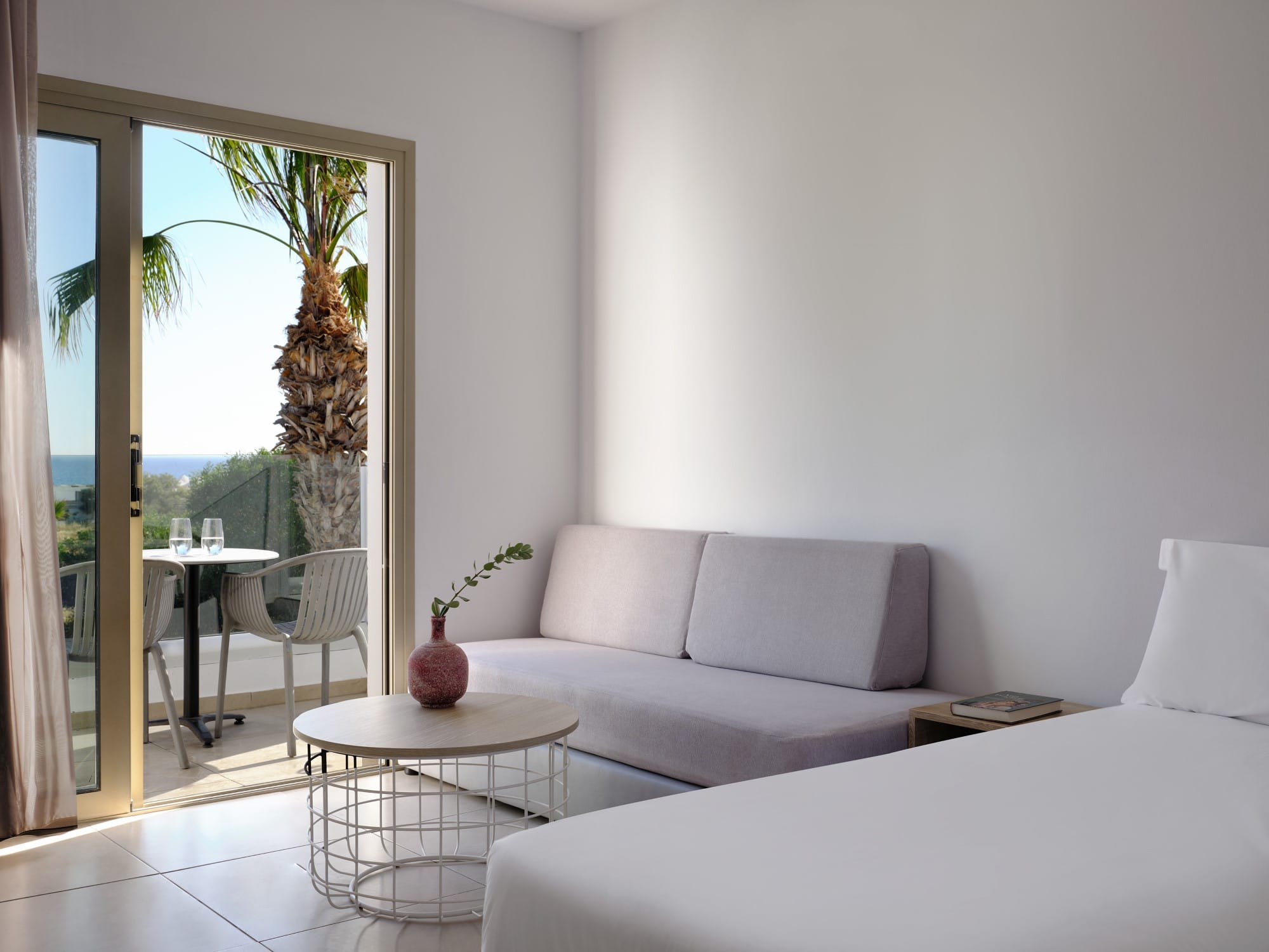 a living room with a white couch and a table