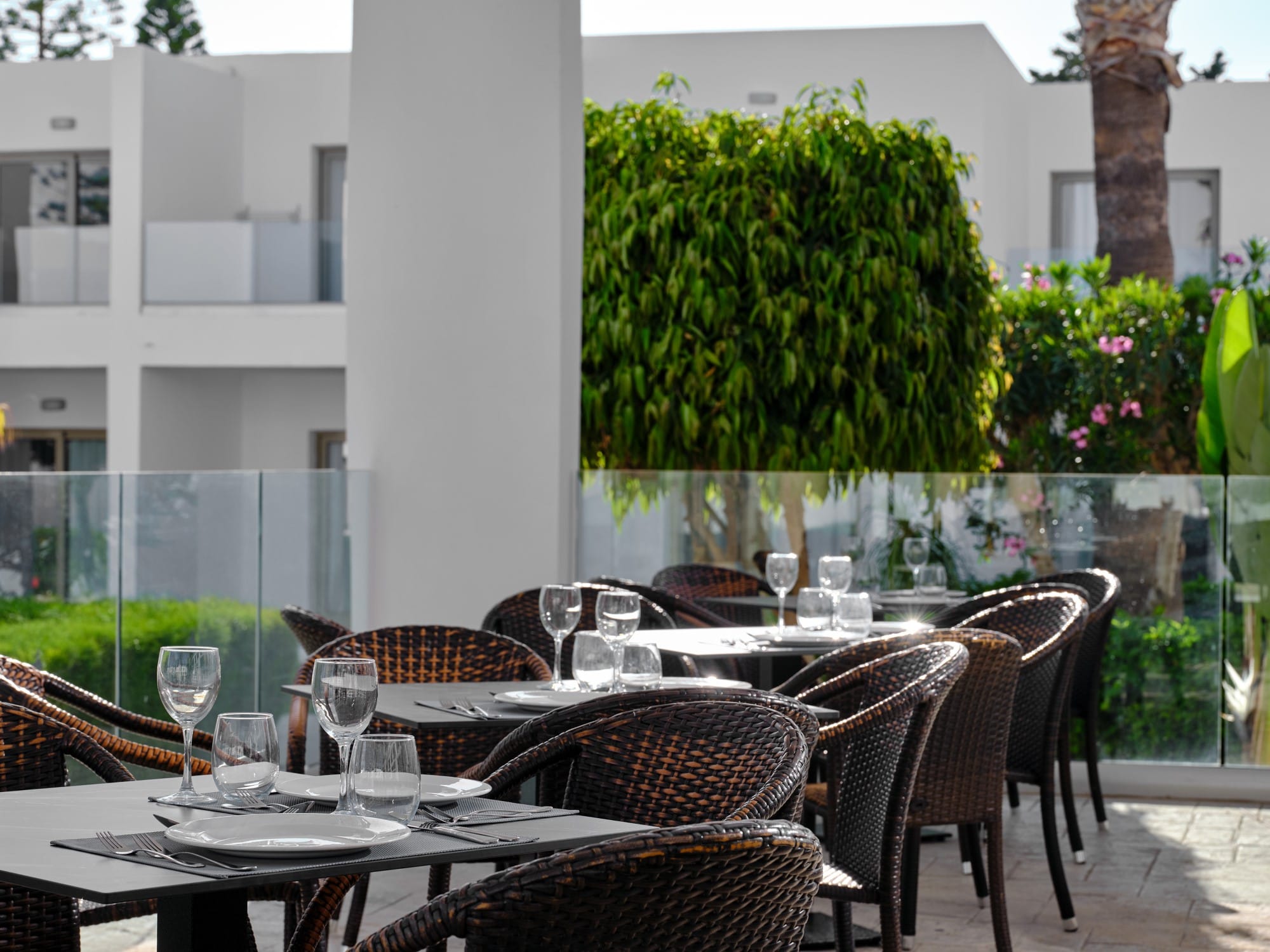 a group of tables and chairs outside