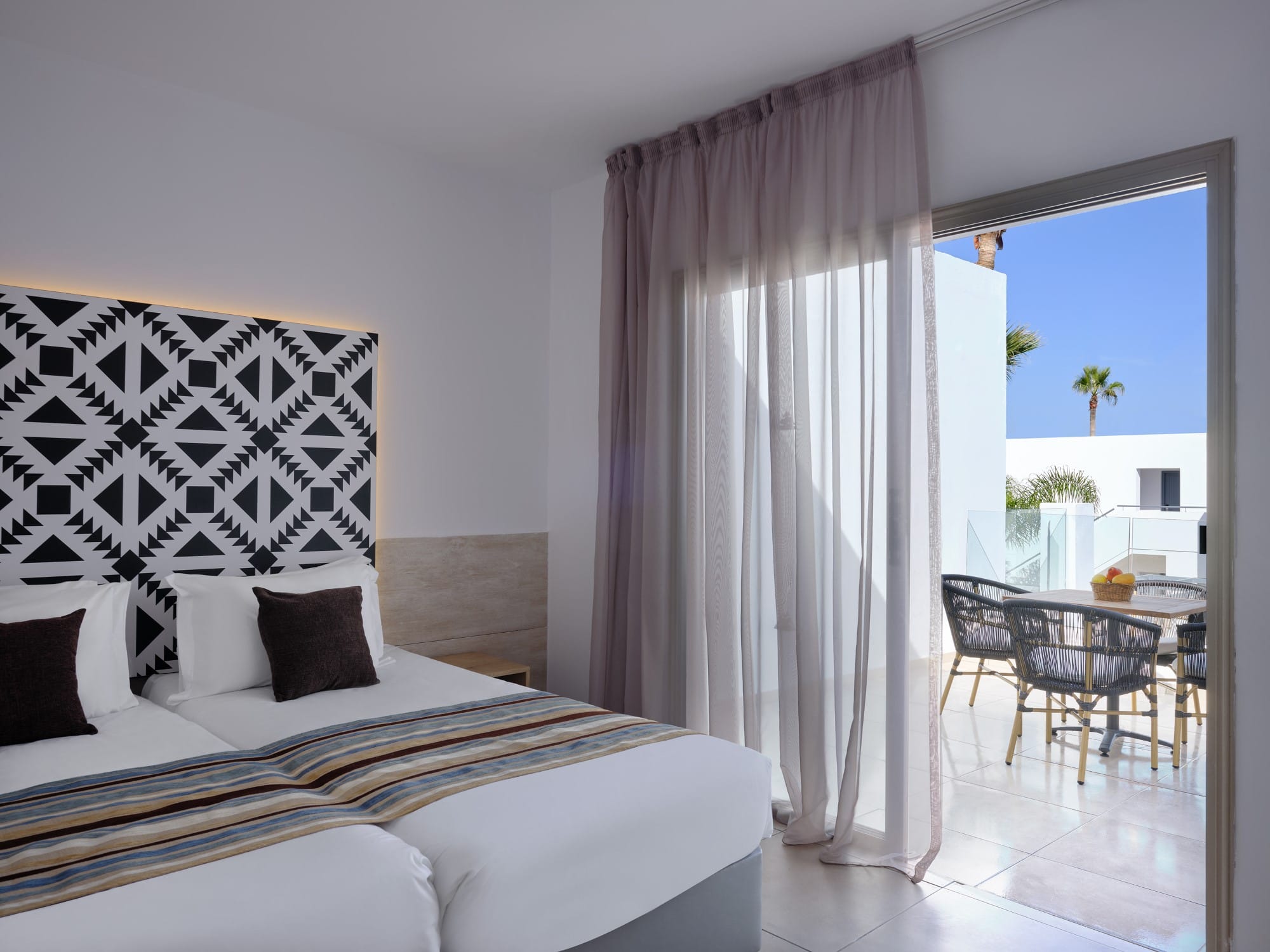 a bedroom with a bed and a table