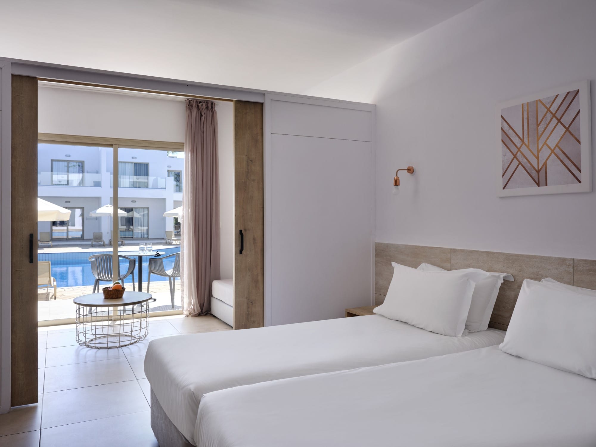 a bedroom with a large window