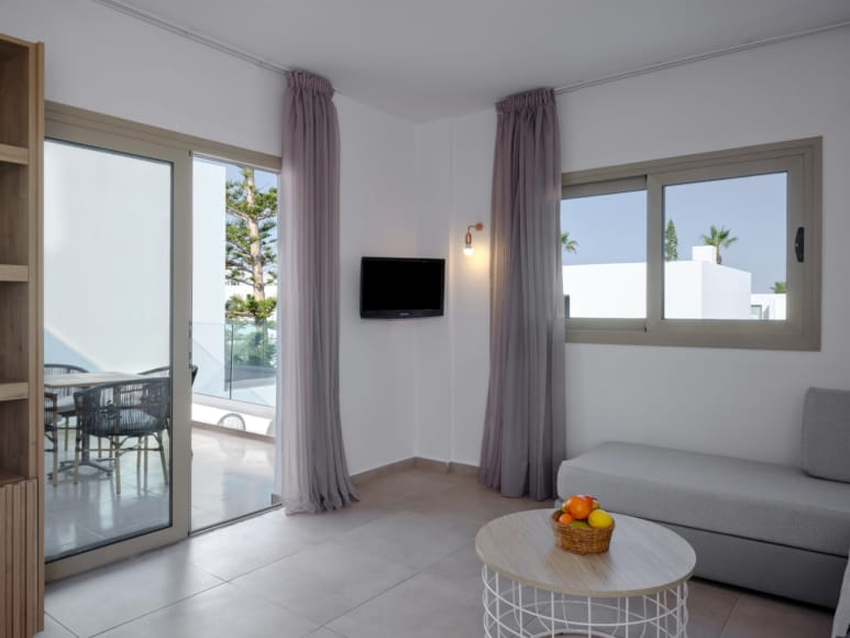 a living room with a white couch and a table