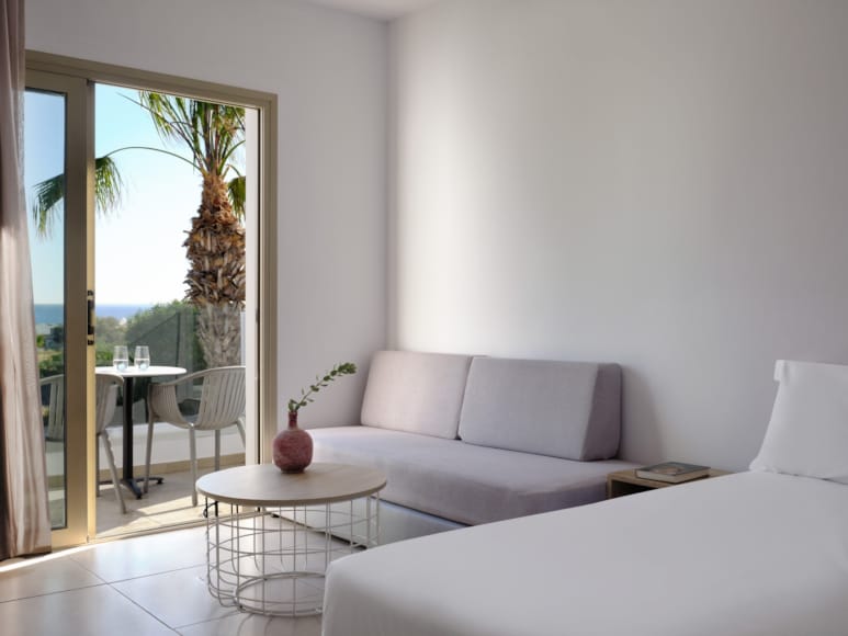 a living room with a white couch and a table