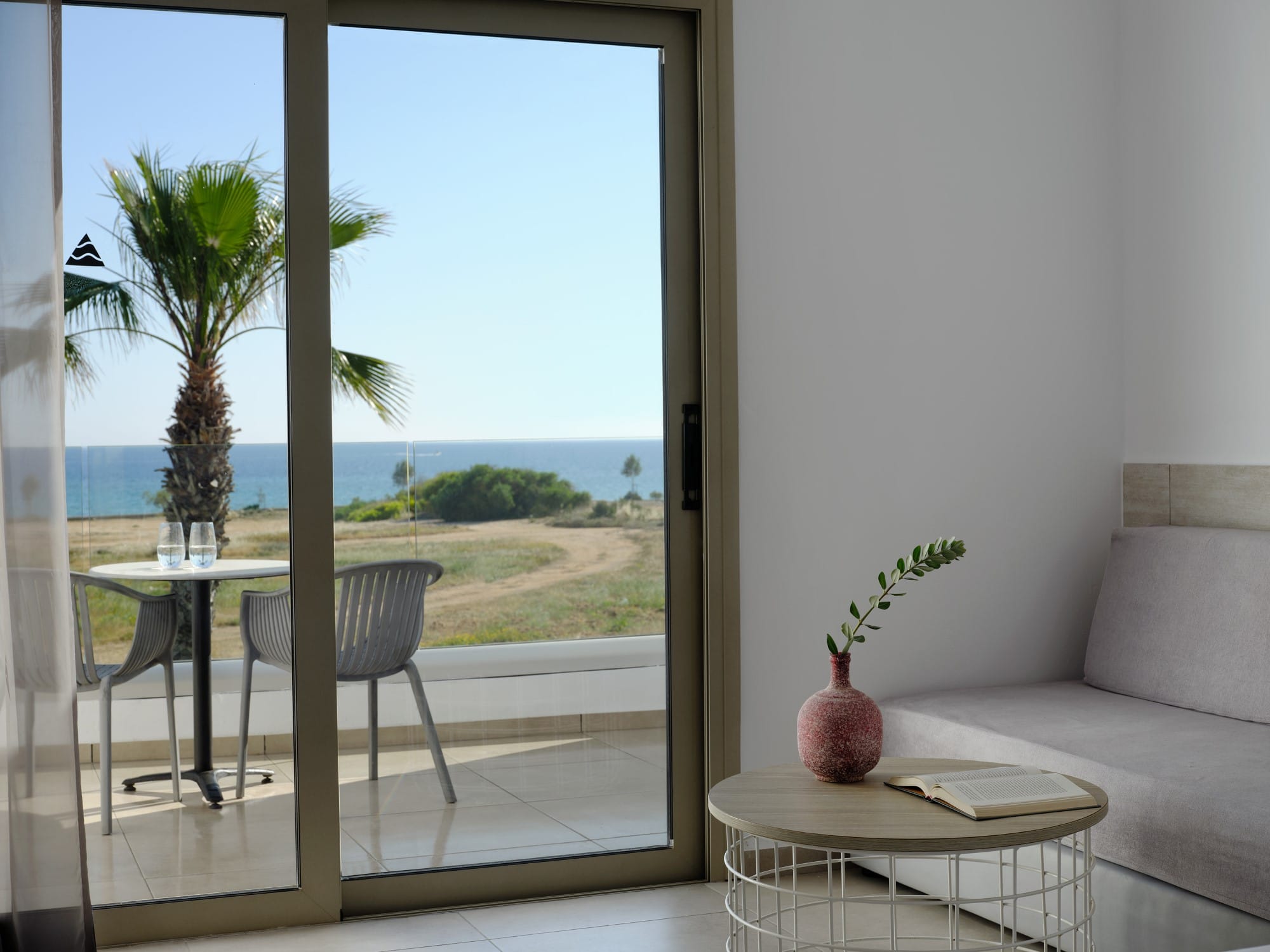 a living room with a table and chairs