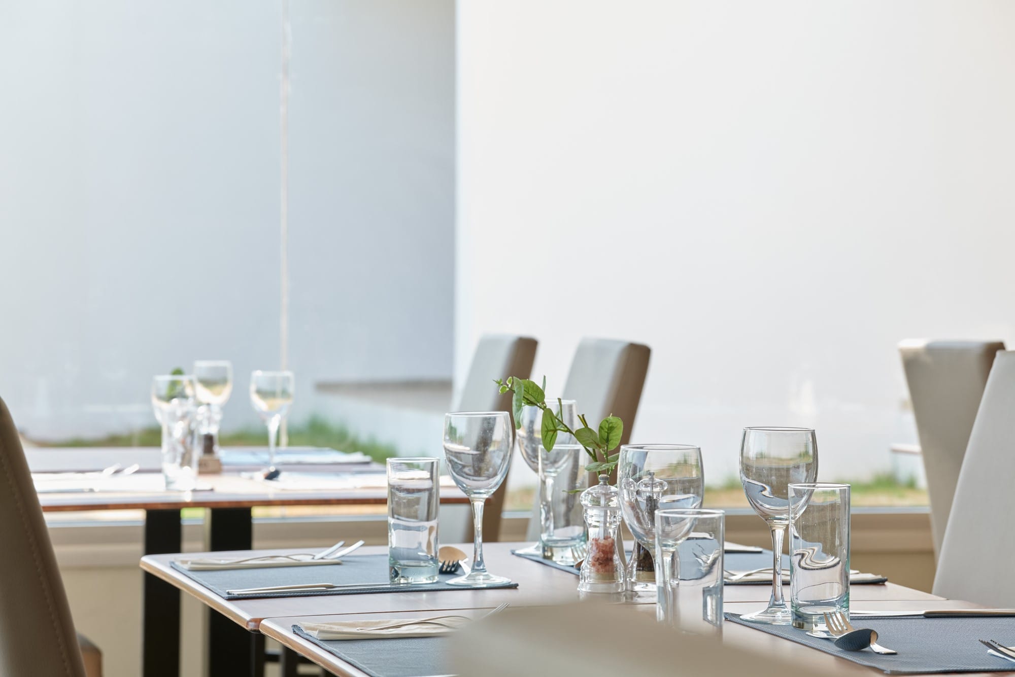 a table with glasses and plates on it