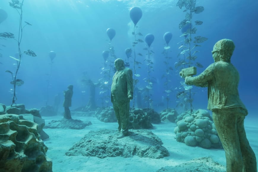 a group of people in a fish tank