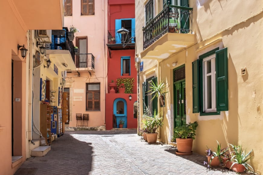 a street with buildings and plants