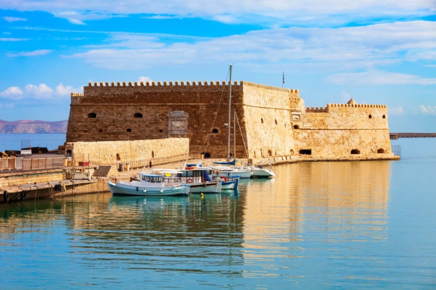 a building with boats in the water
