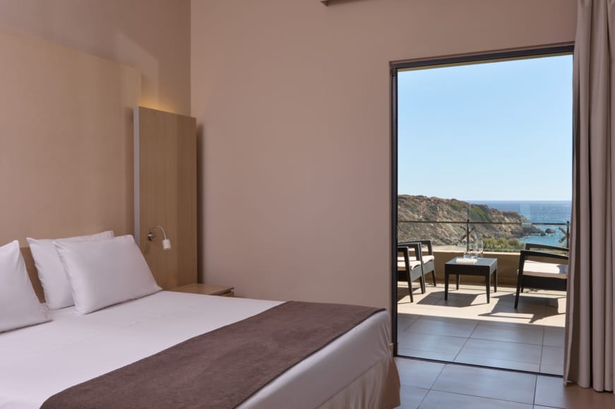 a bedroom with a large window