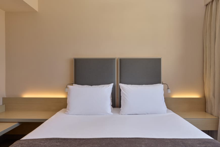 a bed with white sheets