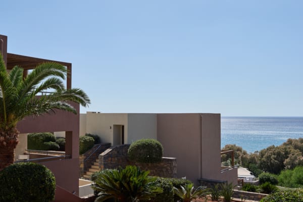 a house with a large body of water in the background