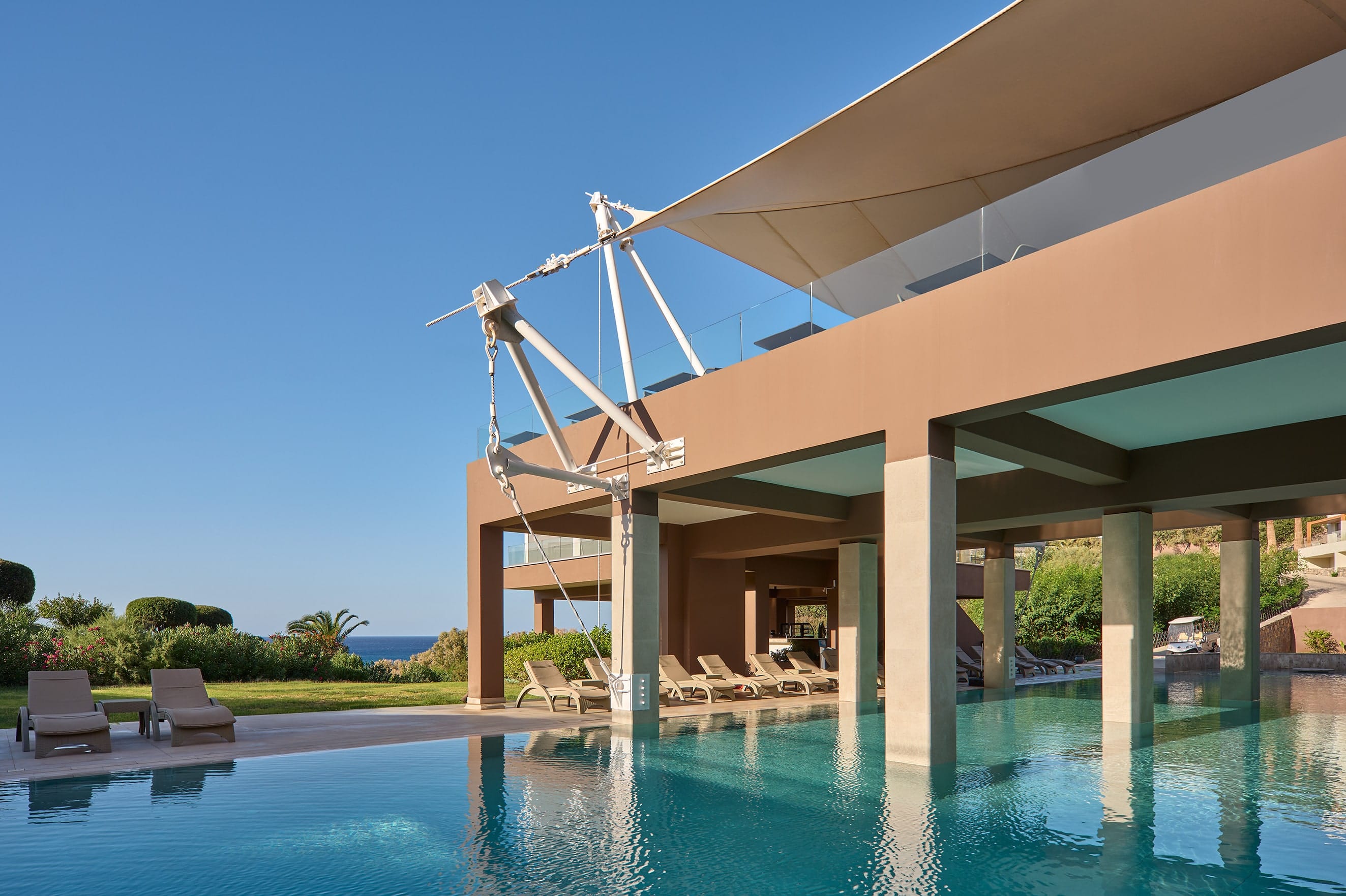 a swimming pool with a covered gazebo